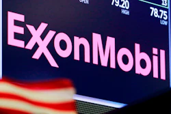 In this April 23, 2018, file photo, the logo for ExxonMobil appears above a trading post on the floor of the New York Stock Exchange. Exxon Mobil is facing a major challenge from a group of investors in one of the biggest fights a corporate boardroom has faced over its stance on climate change, an issue of rising urgency among many shareholders. The investor group is pushing to replace four of the oil giant’s board members with executives who they say are better suited to make money and to lead the company through a transition to cleaner energy.