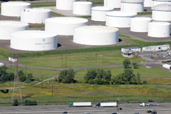 In this Sept. 8, 2008 file photo traffic on I-95 passes oil storage tanks owned by the Colonial Pipeline Company in Linden, N.J. A major pipeline that transports fuels along the East Coast says it had to stop operations because it was the victim of a cyberattack. Colonial Pipeline said in a statement late Friday that it “took certain systems offline to contain the threat, which has temporarily halted all pipeline operations, and affected some of our IT systems.”