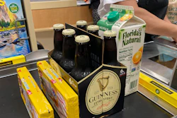 Groceries are shown at a checkout counter, Friday, April 16, 2021, at a grocery store in Surfside, FL.
