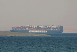 In this March 30, 2021 file photo, the Ever Given, a Panama-flagged cargo ship, is anchored in Egypt's Great Bitter Lake. An Egyptian appeals court on Sunday, May 23, 2021, said it lacks jurisdiction to look into the Suez Canal Authority’s demands to uphold financial claims that led to the the seizure of the massive Ever Given that blocked the waterway in March. The authority and the ship's owners are in dispute as to whose fault it was that the ship ran aground and how much compensation should be paid.