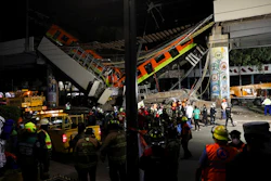 Mexico City's subway cars lay at an angle after a section of Line 12 of the subway collapsed in Mexico City, Tuesday, May 4, 2021. The section passing over a road in southern Mexico City collapsed Monday night, dropping a subway train, trapping cars, and causing at least 50 injuries and several dead, authorities said.
