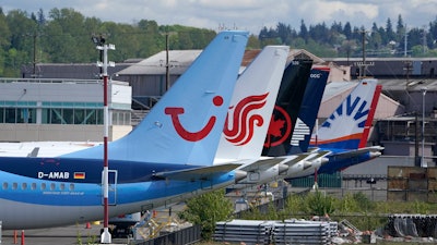 Boeing 737 Max airplanes sit at a storage lot near Boeing Field in Seattle.