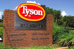 In this July 30, 2001, file photo, a sign marks the entrance to Tyson Foods headquarters in Springdale, Ark. Tyson Foods says it is raising wages to combat absenteeism and worker turnover at its plants as U.S. demand for chicken soars. The Springdale, Arkansas-based company said Monday, May 10, 2021, that absentee rates are around 50% higher than they were before the pandemic.