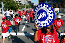 United Auto Workers members walk in the Labor Day parade in Detroit, Sept. 2, 2019.
