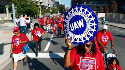 United Auto Workers members walk in the Labor Day parade in Detroit, Sept. 2, 2019.