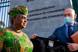 In this Monday, March 1, 2021 file photo, New Director-General of the World Trade Organisation Ngozi Okonjo-Iweala, left, walks at the entrance of the WTO.