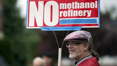 Mark Keely, of Kalama, Wash., stands with other protesters outside the Washington Department of Ecology's Vancouver field office in 2017.