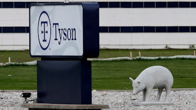 In this May 1, 2020 photo, a sign sits in front of the Tyson Foods plant in Waterloo, IA.