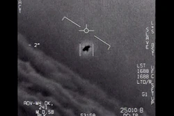 An unexplained object in 2015, at center, tracked as it soars high along the clouds against the wind.