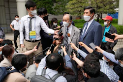 Lim Chul-ho, top center, the son of a deceased forced laborer, speaks at the Seoul Central District Court in Seoul, June 7, 2021.