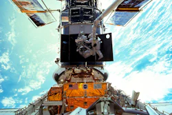 Astronauts Steven L. Smith and John M. Grunsfeld are photographed during an extravehicular activity during the December 1999 Hubble servicing mission of STS-103.