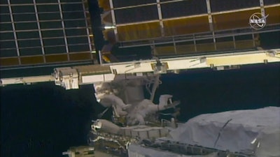 NASA astronaut Shane Kimbrough, left, and French astronaut Thomas Pesquet work on the solar array outside the International Space Station, June 20 2021.
