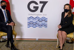 Britain's Chancellor of the Exchequer Rishi Sunak, left, sits with Canada's Finance Minister Chrystia Freeland, ahead of the G7 finance ministers meeting at Lancaster House in London, Friday June 4, 2021.