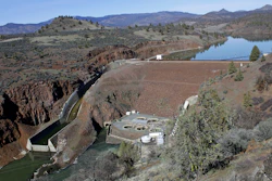 This March 3, 2020, file photo, shows the Iron Gate Dam, powerhouse and spillway on the lower Klamath River near Hornbrook, Calif. A proposal to demolish four dams on the lower Klamath River advanced Thursday, June 17, 2021, when federal regulators allowed the utility company that operates them to exit its license. The decision removes a key hurdle to plans for the largest dam demolition project in U.S. history. PacifiCorp will surrender its license for the hydroelectric dams to the non-profit Klamath River Renewal Corporation and the states of Oregon and California.
