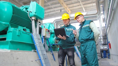 Industrial Workers With Notebook 000050189250 Small