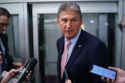 Sen. Joe Manchin, D-W.Va., a key infrastructure negotiator, pauses for reporters after working behind closed doors with other Democrats in a basement room at the Capitol in Washington, Wednesday, June 16, 2021.