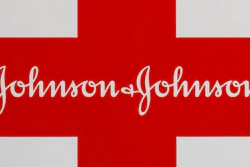 This Feb. 24, 2021 photo shows a Johnson & Johnson logo on the exterior of a first aid kit in Walpole, Mass. The New York attorney general says Johnson & Johnson has agreed to pay $230 million to settle claims that the pharmaceutical giant helped fuel the opioid crisis. The deal requires Johnson & Johnson to make a series of payments over nine years to cover total.
