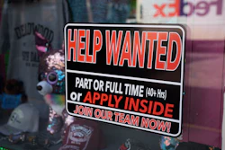 In this May 26, 2021 photo, a sign for workers hangs in the window of a shop along Main Street in Deadwood, S.D. U.S. employers added 559,000 jobs in May, an improvement from April’s sluggish gain but still evidence that many companies are struggling to find enough workers as the economy rapidly recovers from the pandemic recession.