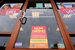 A Now Hiring sign at a business in Richmond, Va., Wednesday, June 2, 2021. U.S. employers posted a record 9.3 million job openings in April as the U.S. economy reopens at break-neck speed. Openings were up 12% from 8.3 million in March.