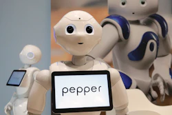 In this May 25, 2016, file photo, Pepper, the robot of Softbank Robotics Europe, performs during the Innorobo European summit, an event dedicated to the service robotics industry in Aubervilliers, outskirts of Paris.