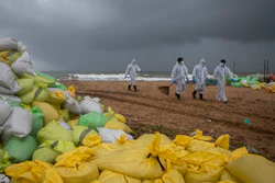 Sri Lankan navy soldiers walk on the beach looking for plastic debris washed ashore from fire damaged container ship MV X-Press Pearl at Kapungoda, on the outskirts of Colombo, Sri Lanka. Monday, June 14, 2021.