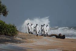 Sri Lankan navy soldiers collect debris that washed ashore from burning ship MV X-Press Pearl anchored off Colombo port at Kapungoda, out skirts of Colombo, Sri Lanka, Monday, May 31, 2021. The fire on the Singapore-flagged ship has been burning since May 20, ravaging the ship. Debris from the burning ship that has washed ashore is causing severe pollution on beaches.