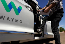 In this April 7, 2021 file photo, a Waymo minivan arrives to pick up passengers for an autonomous vehicle ride, in Mesa, Ariz. Waymo, the self-driving car pioneer spun off from Google, isn't allowing a recent wave of executive departures to detour its plans to expand its robotic taxi service.