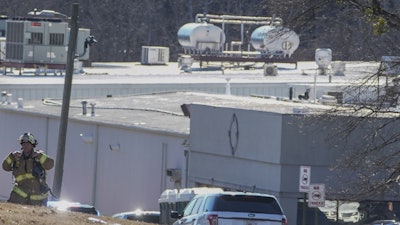 A Hall County firefighter leaves following a liquid nitrogen leak that killed six people at Prime Pak Foods, a poultry plant, on Jan. 28 in Gainesville, GA.