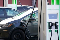 A Chevrolet Bolt charges at an Electrify America site, Lakewood, Colo., Dec. 21, 2020.