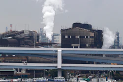 Smoke billows from an oil refinery in Kawasaki, Tokyo, Oct. 21, 2013.