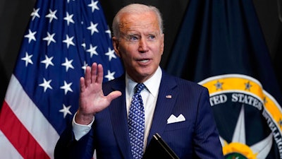 President Joe Biden finishes leaves after speaking during a visits to the Office of the Director of National Intelligence in McLean, VA on Tuesday, July 27.