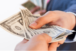 Business Man Giving Bank Notes To Another Person 516934262 2125x1416 (1)