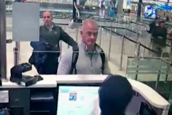 This Dec. 30, 2019, image from security camera video shows Michael L. Taylor, center, and George-Antoine Zayek at passport control at Istanbul Airport in Turkey.