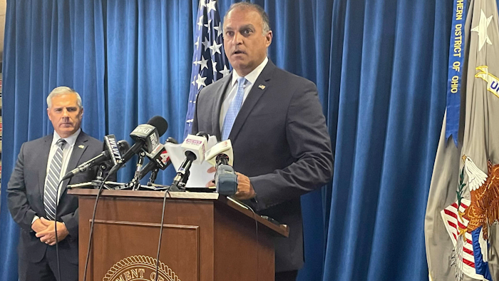 Acting U.S. Attorney Vipal J. Patel, center, accompanied by FBI Special Agent in Charge Chris Hoffman, speaks during a news conference in Cincinnati, Thursday, July 22, 2021. Federal authorities say Akron-based FirstEnergy Corp. would pay a $230 million penalty and fully cooperate as part of an agreement announced Thursday to settle federal charges against the company in a sweeping bribery scheme in Ohio.