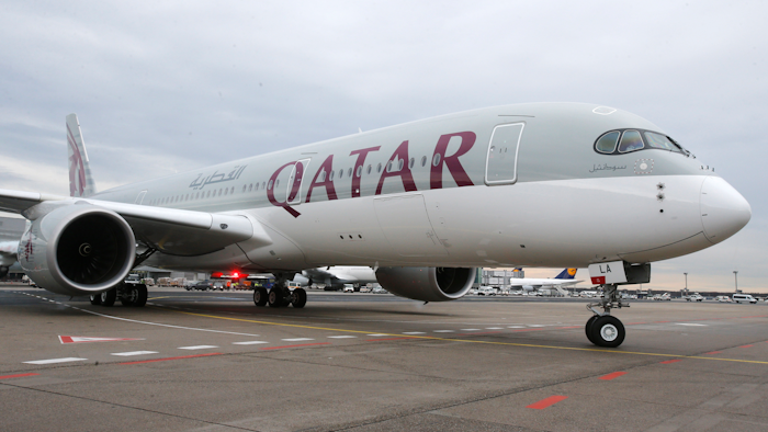 In this Jan. 15, 2015 file photo, a new Qatar Airways Airbus A350 approaches the gate at the airport in Frankfurt, Germany. Qatar Airways said Thursday, Aug. 5, 2021, that it has grounded 13 Airbus A350s over degradation of the plane's fuselage, further escalating a monthslong dispute with the European airplane maker.