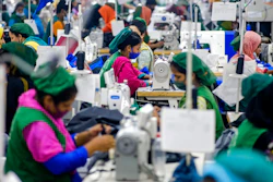 Garment employees work in a sewing section of the Snowtex Outerwear Ltd. factory in Savar, Bangladesh, on Aug. 9, 2021. Bangladesh is suffering through its deadliest surge of the pandemic, but you wouldn't know it looking at its factories, markets and malls. At the Snowtex Outerwear Ltd. factory on the outskirts of Dhaka, the company's 15,000 workers now walk through a “disinfectant tunnel” in which they are sprayed with sanitizer before they get to work turning heaps of fabric into clothing sold in countries around the world.