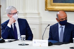 Apple CEO Tim Cook, left, and IBM CEO Arvind Krishna listen as President Joe Biden speaks during a meeting about cybersecurity in the East Room of the White House, Wednesday, Aug. 25, 2021, in Washington.