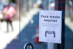 A sign advises shoppers to wear masks outside of a story Monday, July 19, 2021, in the Fairfax district of Los Angeles. Los Angeles County has reinstated an indoor mask mandate due to rising COVID-19 cases.