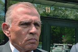 In this May 22, 2019, file photo, Ariel Quiros, left, former owner of Jay Peak Resort, stands outside the federal courthouse in Burlington, Vt., after his arraignment on fraud charges over a failed plan to build a biotechnology plant using foreign investors' money. The Miami businessman, accused of being the mastermind behind a massive fraud case involving foreign investors' money in Vermont developments, is expected to plead guilty in next week in a plea deal in which prosecutors are seeking a sentence of more than eight years in prison.