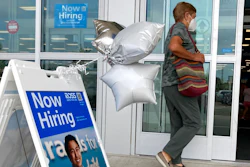 A shopper passes a hiring sign while entering a retail store in Morton Grove, Ill., Wednesday, July 21, 2021. Despite an uptick in COVID-19 cases and a shortage of available workers, the U.S. economy likely enjoyed a burst of job growth last month as it bounces back with surprising vigor from last year’s coronavirus shutdown. The Labor Department’s July jobs report Friday, Aug. 6 is expected to show that the United States added more than 860,000 jobs in July, topping June’s 850,000, according to a survey of economists by the data firm FactSet.