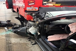 This Friday, May 11, 2018, photo released by the South Jordan Police Department shows a traffic collision involving a Tesla Model S sedan with a Fire Department mechanic truck stopped at a red light in South Jordan, Utah.