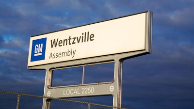 In this March 24, 2021 photo, a sign stands near an entrance to a General Motors assembly plant in Wentzville, Mo.