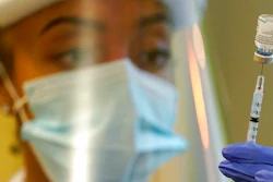 In this Jan. 8, 2021, file photo, a pharmacist prepares a syringe of the Pfizer vaccine for COVID-19, at Queen Anne Healthcare, a skilled nursing and rehabilitation facility in Seattle. The U.S. vaccination drive against COVID-19 stood on the verge of a major new phase as government advisers Thursday, Sept. 23, recommended booster doses of Pfizer's vaccine for millions of older or otherwise vulnerable Americans — despite doubts the extra shots will do much to slow the pandemic.