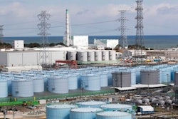 In this Saturday, Feb. 27, 2021, file photo, Nuclear reactors of No. 5, center left, and 6 look over tanks storing water that was treated but still radioactive, at the Fukushima Daiichi nuclear power plant in Okuma town, Fukushima prefecture, northeastern Japan.