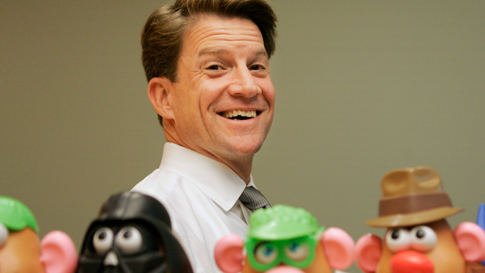 Brian Goldner of Hasbro stands next to some of the company's toy figures at its headquarters, Pawtucket, R.I., May 20, 2008.