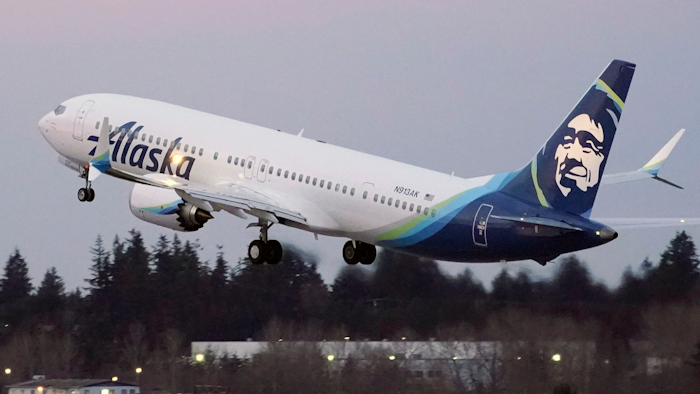 In this Monday, March 1, 2021 file photo, The first Alaska Airlines passenger flight on a Boeing 737-9 Max airplane takes off on a flight to San Diego from Seattle-Tacoma International Airport in Seattle. A Boeing pilot involved in testing the 737 Max jetliner was indicted Thursday, Oct. 14,2021 by a federal grand jury on charges of deceiving safety regulators who were evaluating the plane, which was later involved in two deadly crashes.