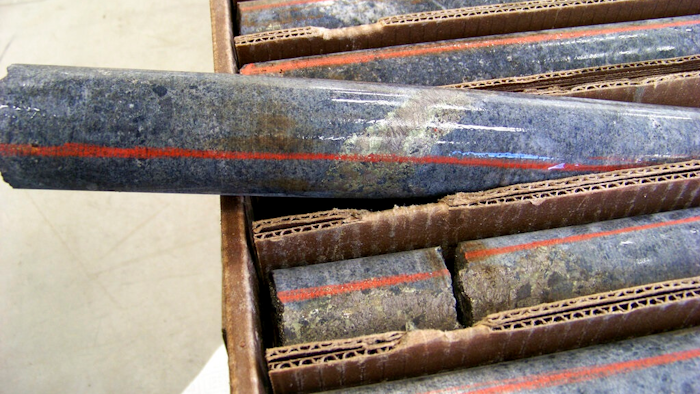 In this Oct. 4, 2011, file photo, a core sample drilled from underground rock near Ely, Minn., shows a band of shiny minerals containing copper, nickel and precious metals, center, that Twin Metals Minnesota LLC, hopes to mine near the Boundary Waters Canoe Area Wilderness in northeastern Minnesota. The Biden administration ordered a study Wednesday, Oct. 20,2021, that could lead to a 20-year ban on mining upstream from the wilderness.