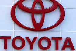 The Toyota logo is shown on a dealership in Manchester, N.H., in this Thursday, Aug. 15, 2019, file photo. Toyota plans to build a new $1.29 billion factory in the U.S. to manufacture batteries for gas-electric hybrid and fully electric vehicles. The plant location wasn't announced, but the company said it eventually will employ 1,750 people and start making batteries in 2025, gradually expanding through 2031.