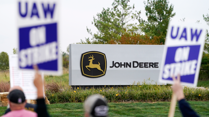 Members of the United Auto Workers strike outside of a John Deere plant, Wednesday, Oct. 20, 2021, in Ankeny, Iowa. The farm equipment manufacturer reached a tentative labor agreement Saturday, Oct. 30, with the United Auto Workers union.
