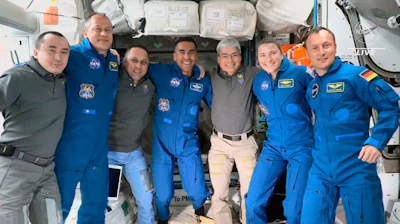 In this image from video provided by NASA, the Expedition 66 crew poses for a photo after SpaceX Crew-3’s arrival to International Space Station, Thursday, Nov. 11, 2021. A SpaceX capsule carrying four astronauts pulled up Thursday at the International Space Station, their new home until spring.